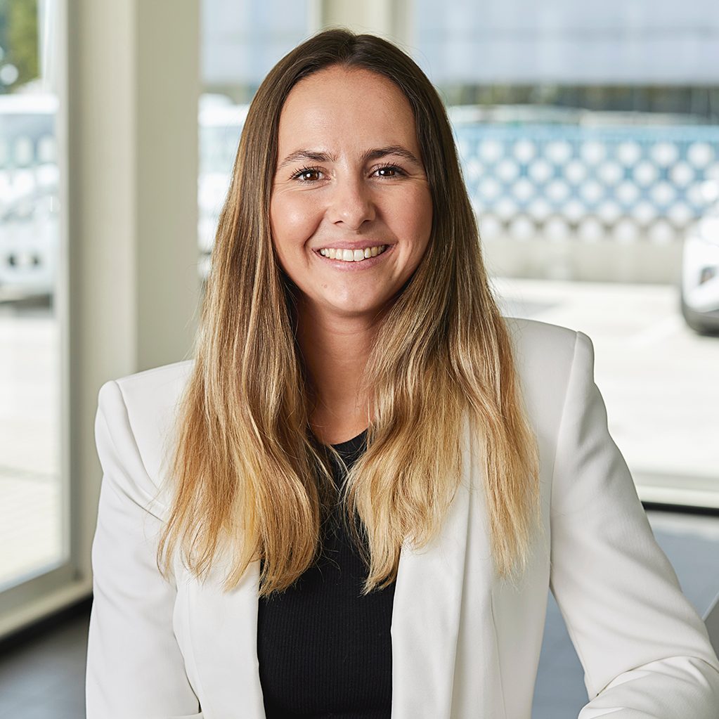 Team member smiling to camera 