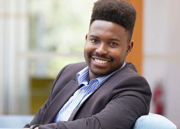 Professional portrait sitting in chair