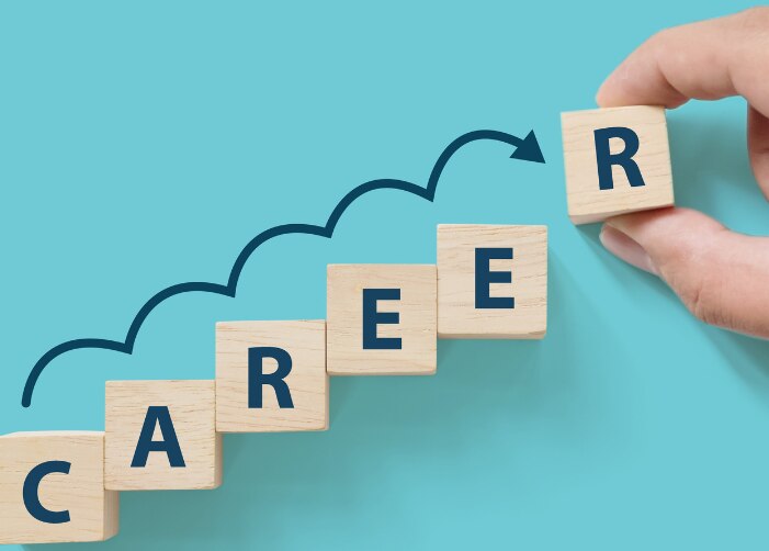 Blocks being arranged in a stair step pattern to spell "Career"