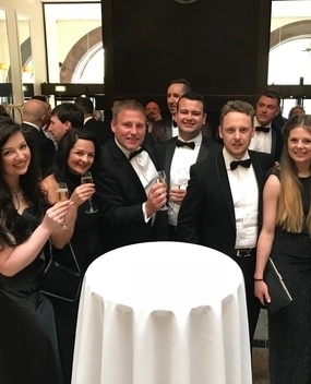 Employees at a black tie event