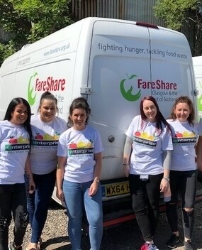 Employees next to "FareShare" van