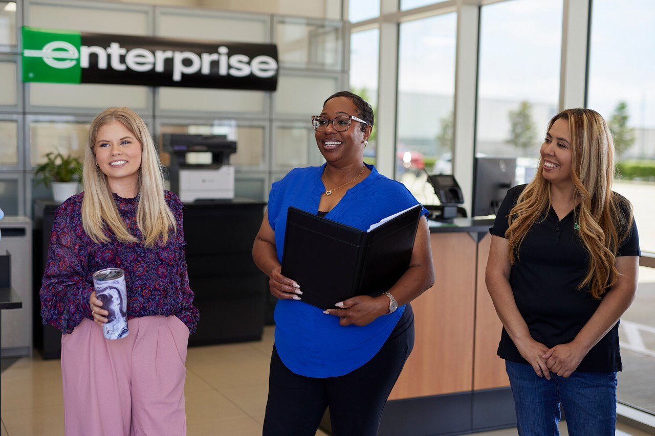 Enterprise Mobility team members standing in a retail branch. 