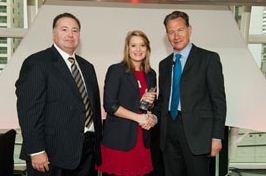 Grace Grimson receiving the Management Undergraduate of the Year award with two professionals