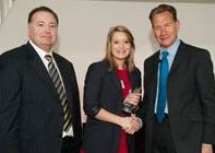 Grace Grimson receiving the Management Undergraduate of the Year award with two professionals