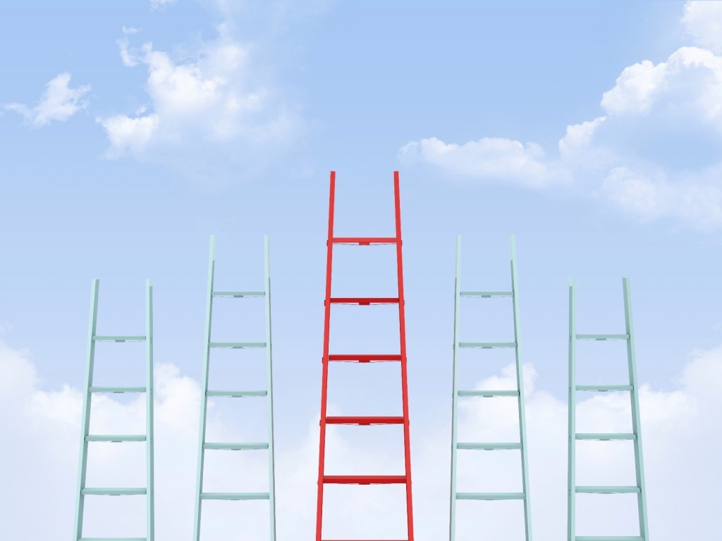 Five ladders with a taller red one in the middle on a sky background
