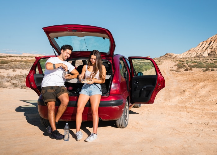 Man and woman tailgating in the mountains