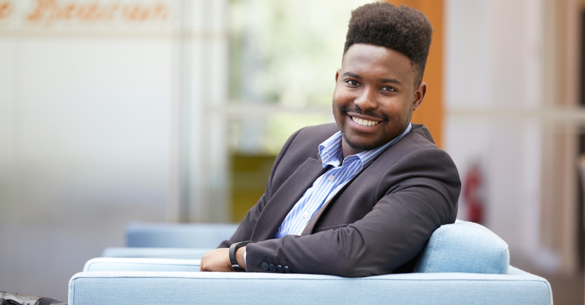 Professional portrait sitting in chair