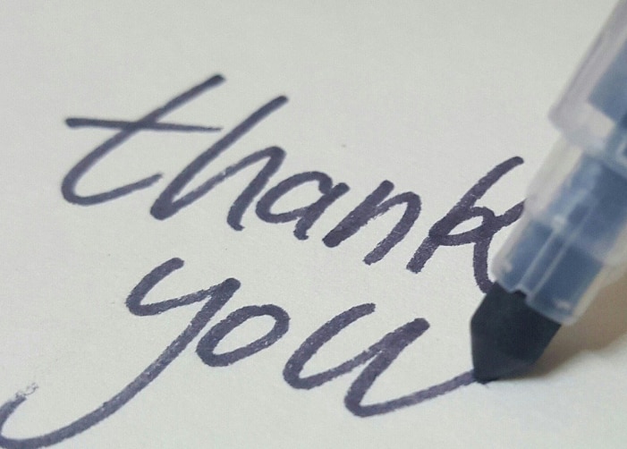 Pen writing "thank you"