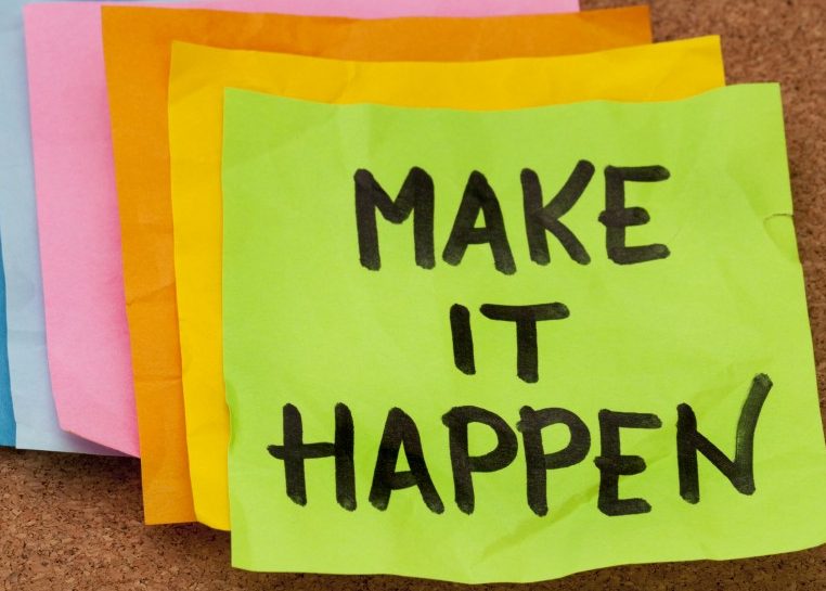 Sticky notes on a cork board 