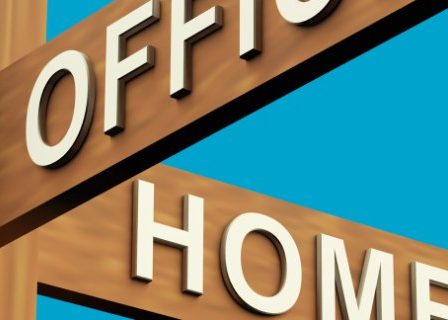 Wooden street sign showing the intersection of "office" and "home"