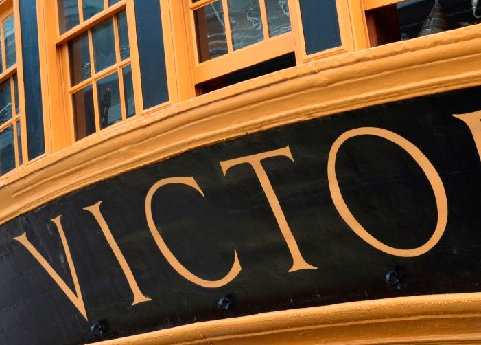 Black and gold building that says "Victory"