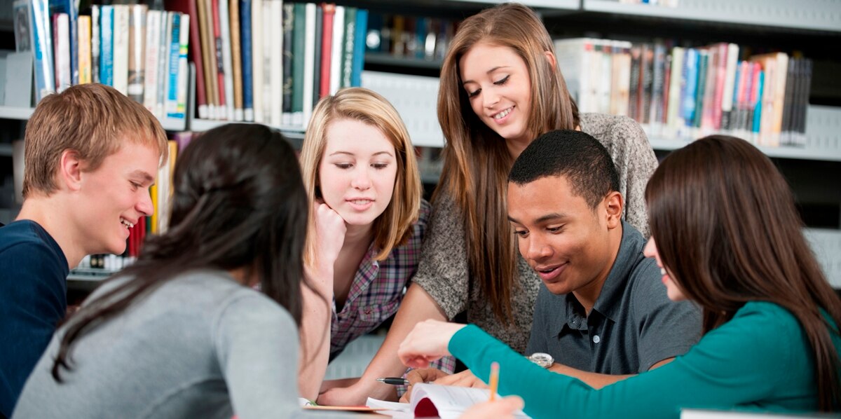 Students studying together in a library