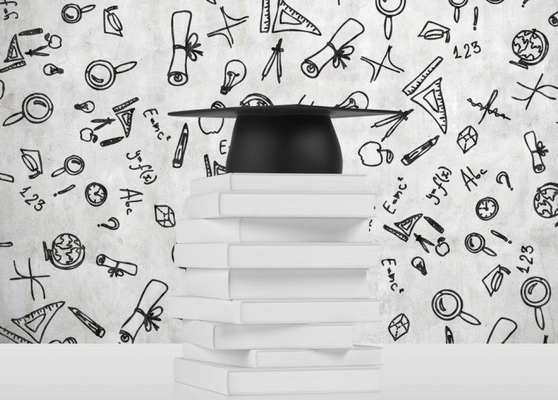 Graduation cap on top of stack of books with academic icons in the background