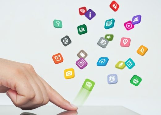 finger pressing an iPad and app icons are flying up