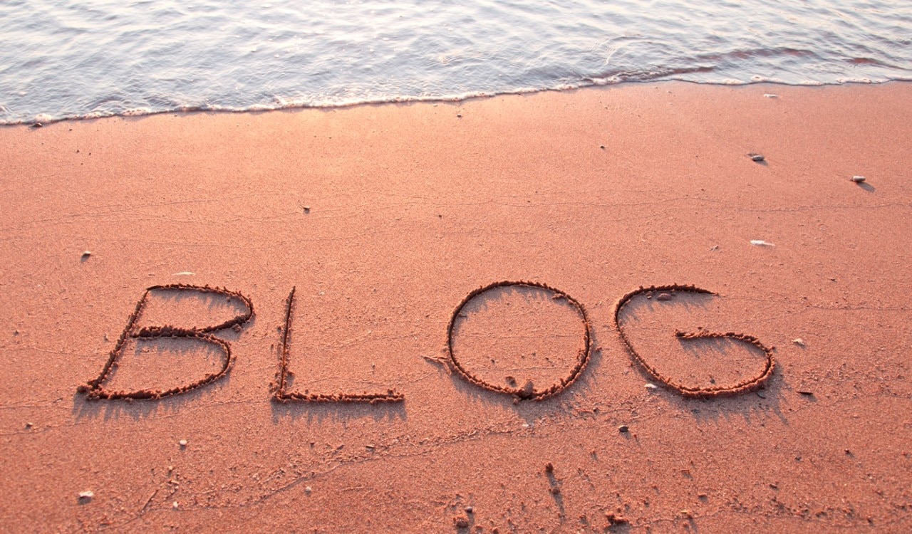"BLOG" written in the sand on a beach