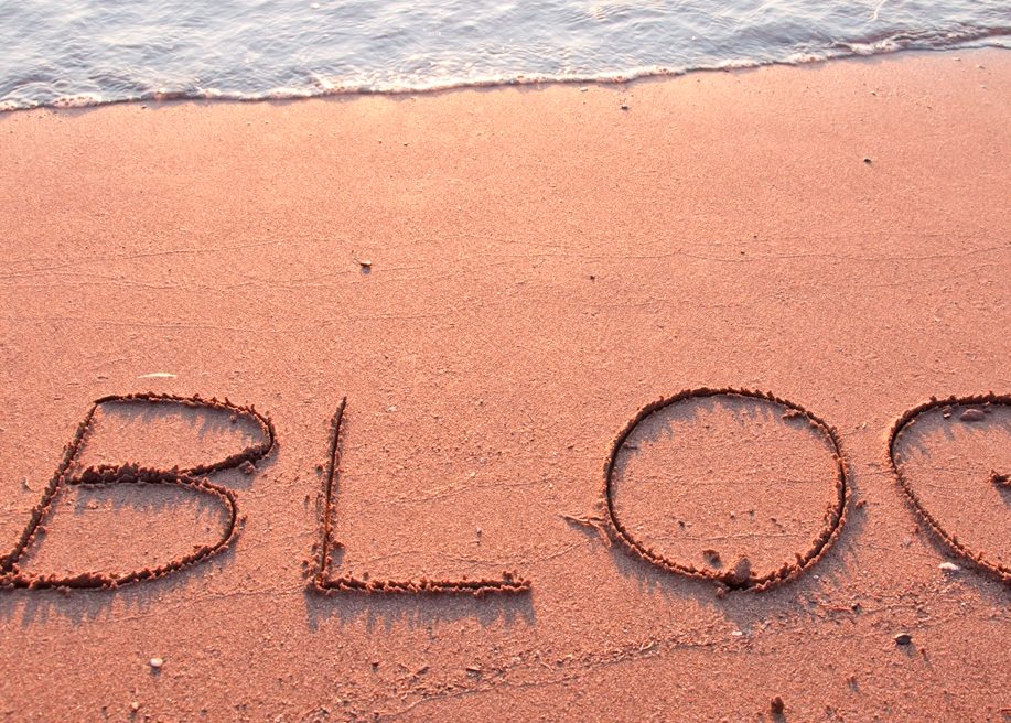 "BLOG" written in the sand on a beach
