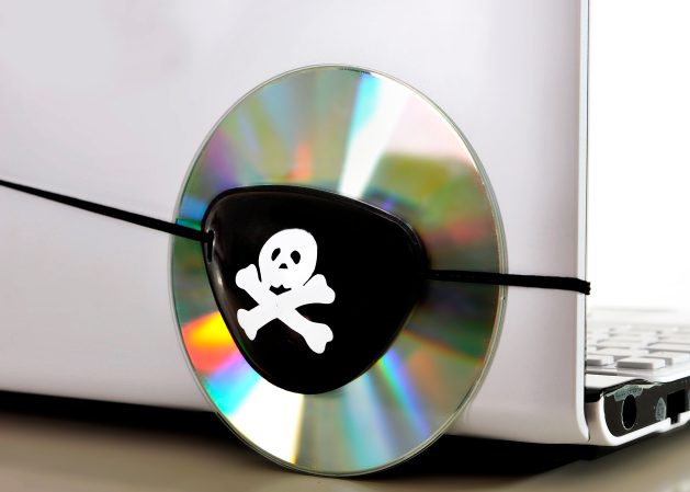 CD strapped to a laptop with a pirate eyepatch