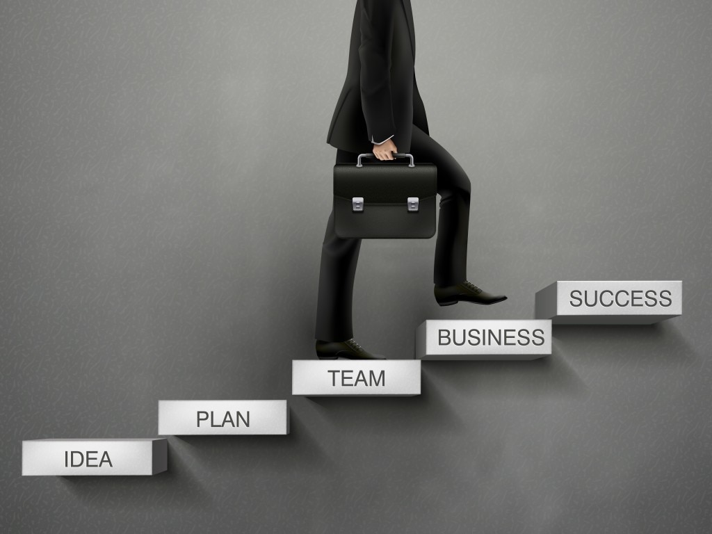 Man with brief case climbing the "ladder of success"