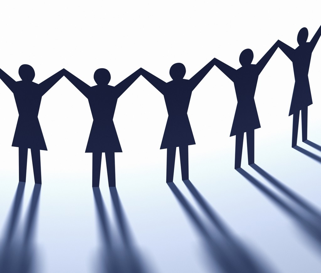 Paper chain people on white background with shadows