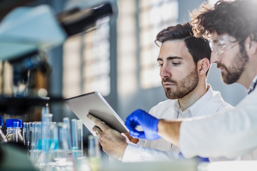 Two scientists in lab coats in a laboratory 