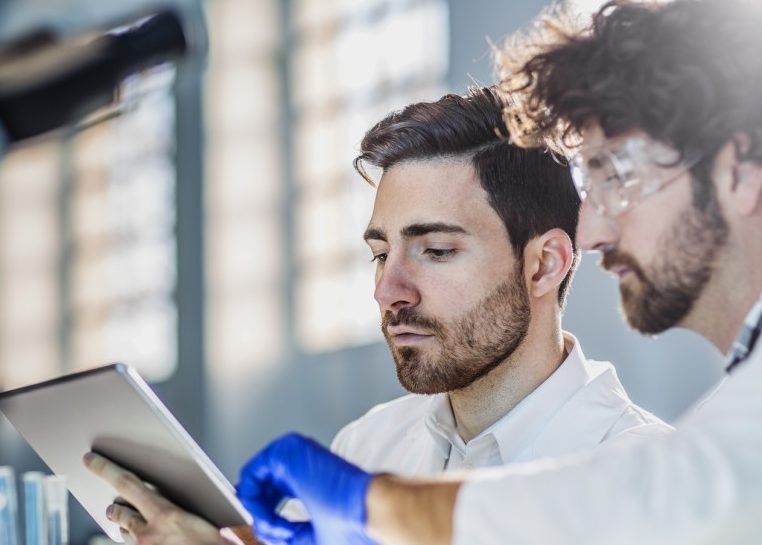 Two scientists in lab coats in a laboratory 