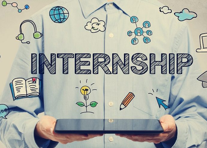 Man in dress shirt holding an iPad with "Internship" and other icons coming from it