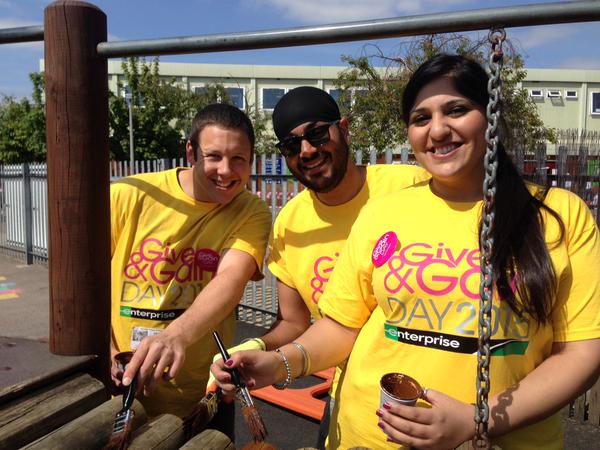 Three people in yellow shirts