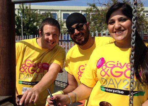 Three people in yellow shirts
