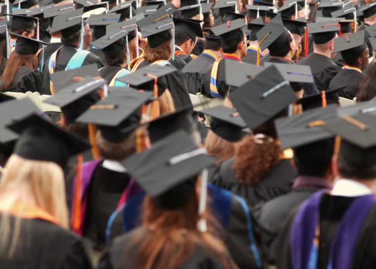 Student in graduation caps and gowns