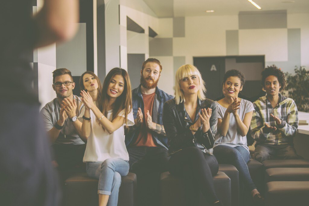 Students clapping after a presentation
