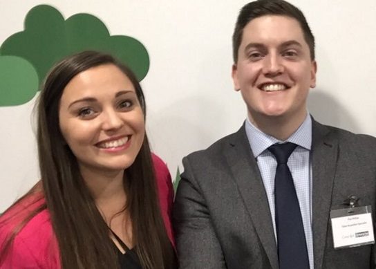 Gabriella smiling with a male coworker