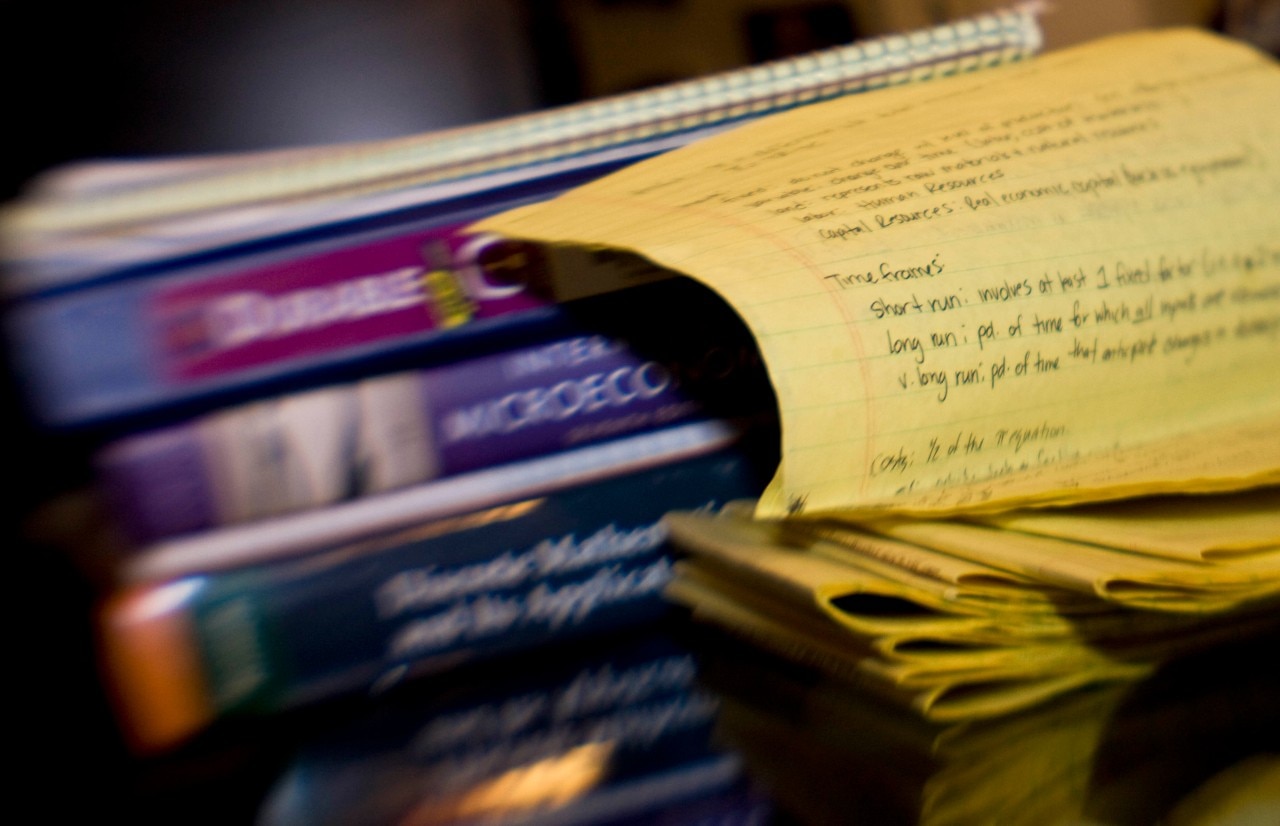 Notebook next to text books