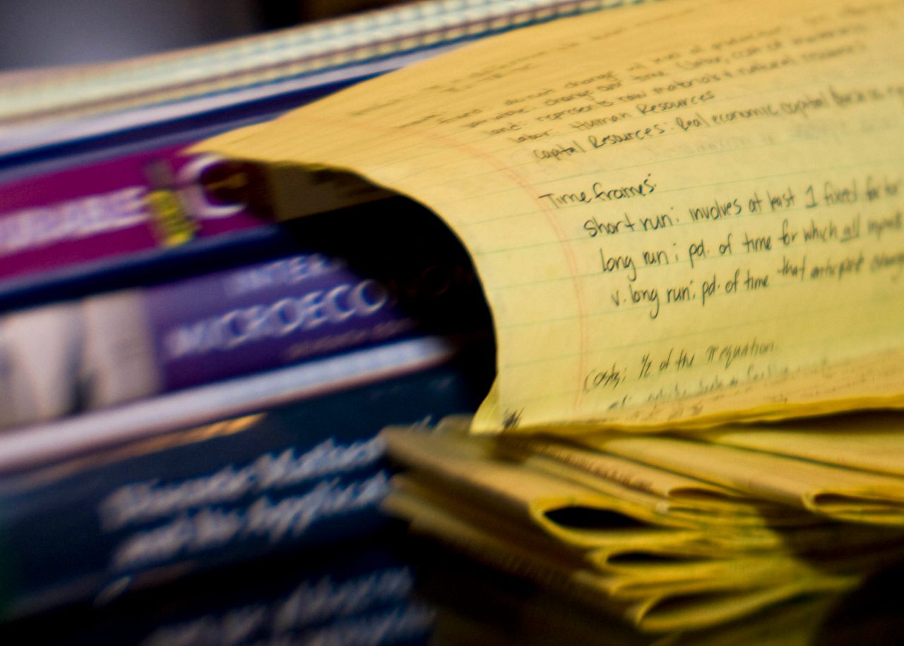 Notebook next to text books
