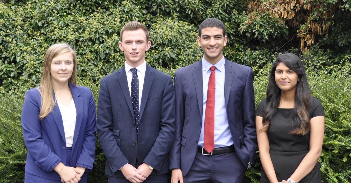Four Enterprise Interns in business attire