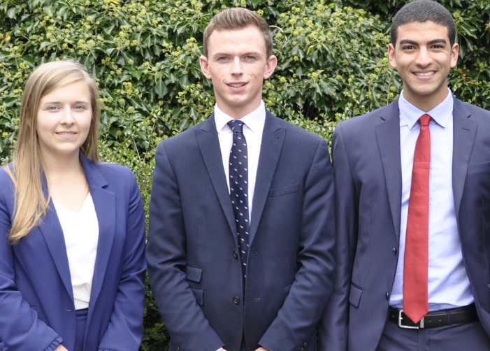 Four Enterprise Interns in business attire