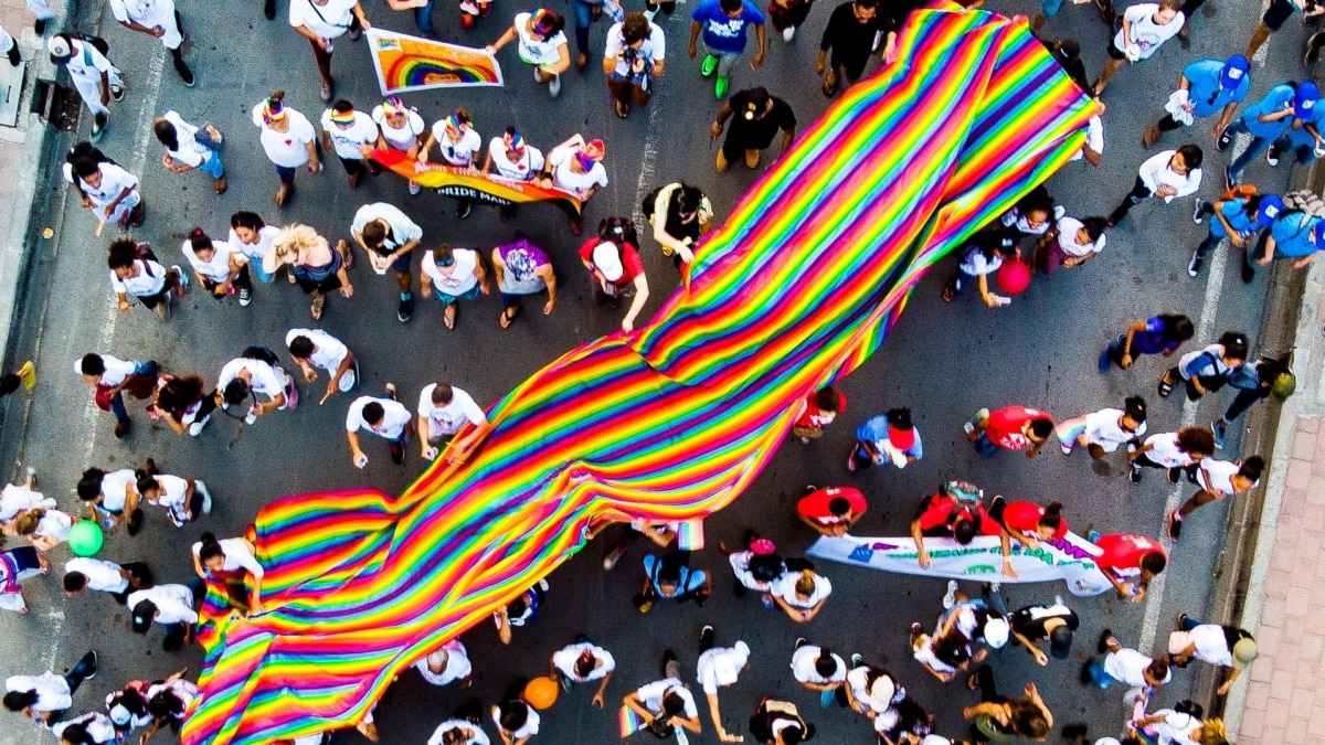 PRIDE Parade with large PRIDE flag