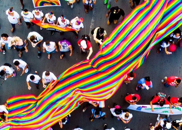 PRIDE Parade with large PRIDE flag