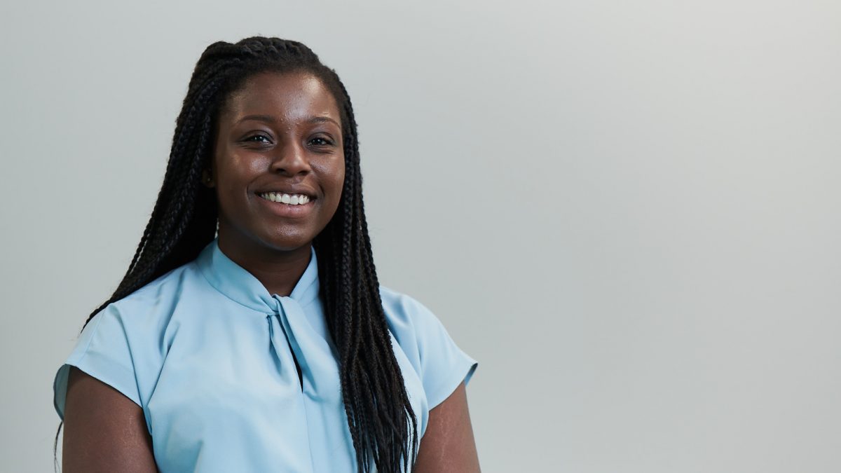 Female employee headshot on grey background