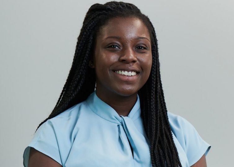 Female employee headshot on grey background