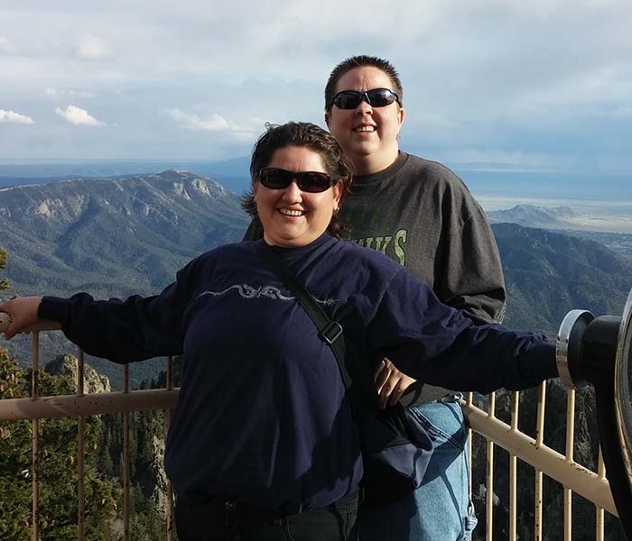 Amy and Ace overlooking a mountain