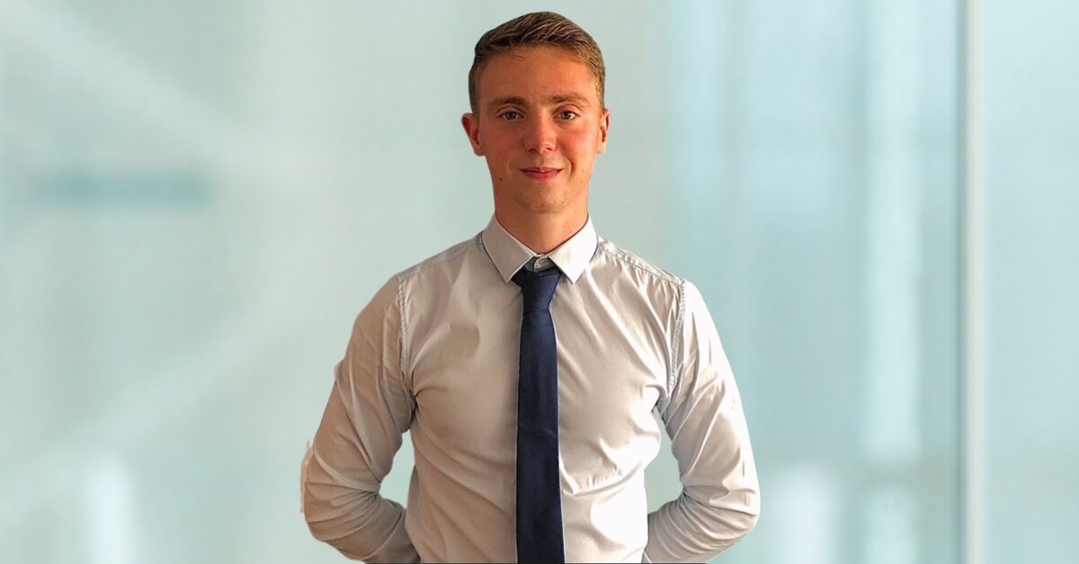 Picture of Fabio in a white shirt and black tie on a light blue background