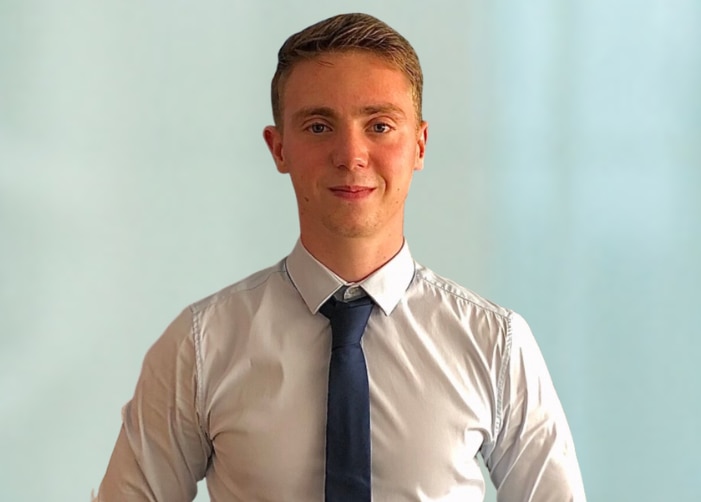 Picture of Fabio in a white shirt and black tie on a light blue background