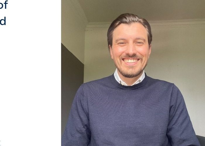 Selfie of Fraser in a grey jumper with a quote on a white background