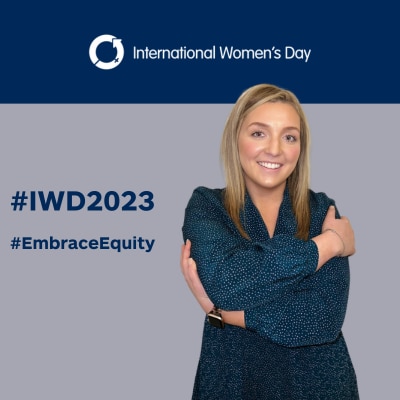 Hayley embrassing herself on #IWD2023 background