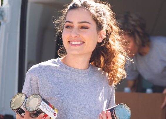 two university students packing tins of food ready to start university