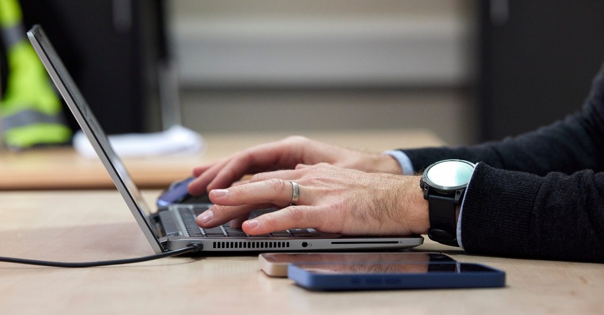 Enterprise Mobility team member on a laptop using chatgpt.