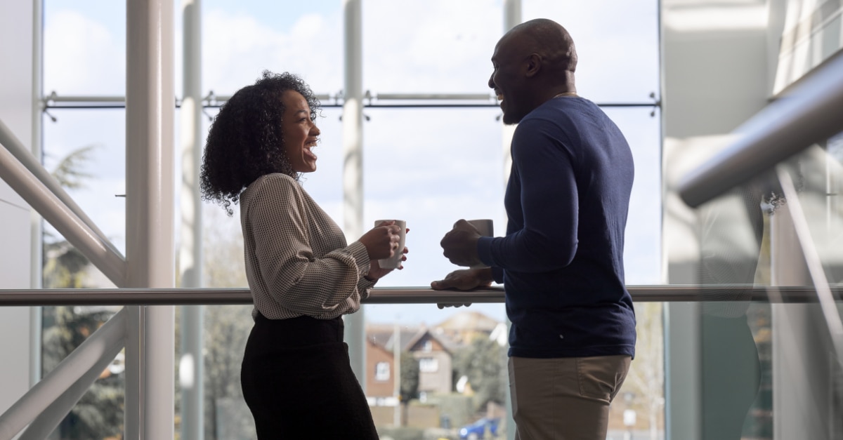 Enterprise Mobility team members laughing with coffee