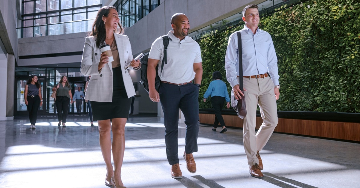 Enterprise Mobility employees walking down corridor at work in their new careers