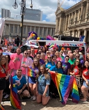 Employees at a PRIDE event