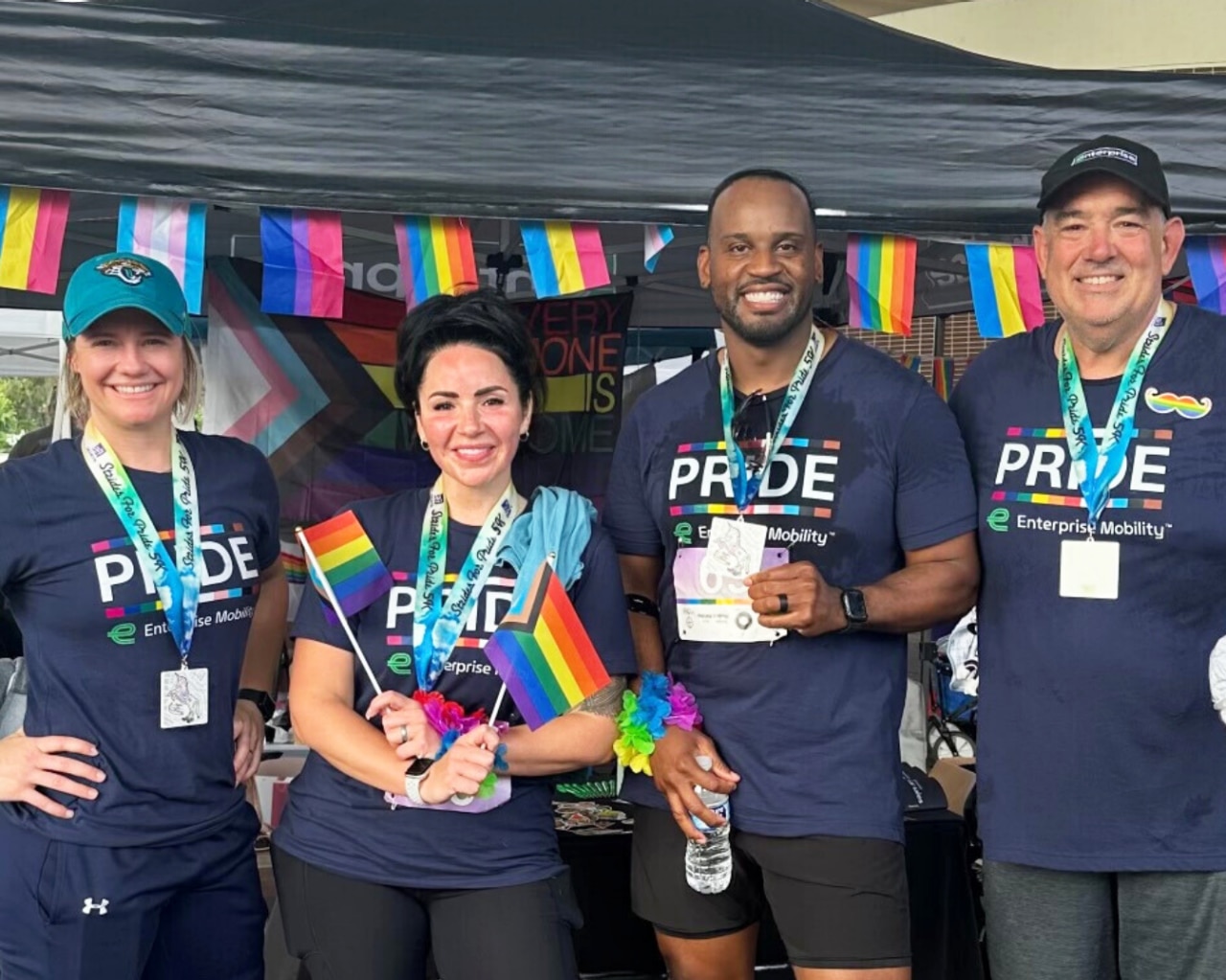 Enterprise Mobility team members participating in a Pride parade.